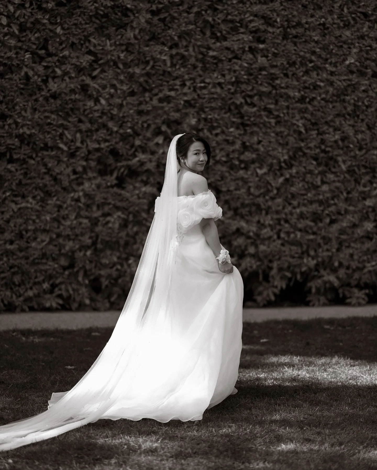 Bride smiling during an evening portrait session on her wedding day.