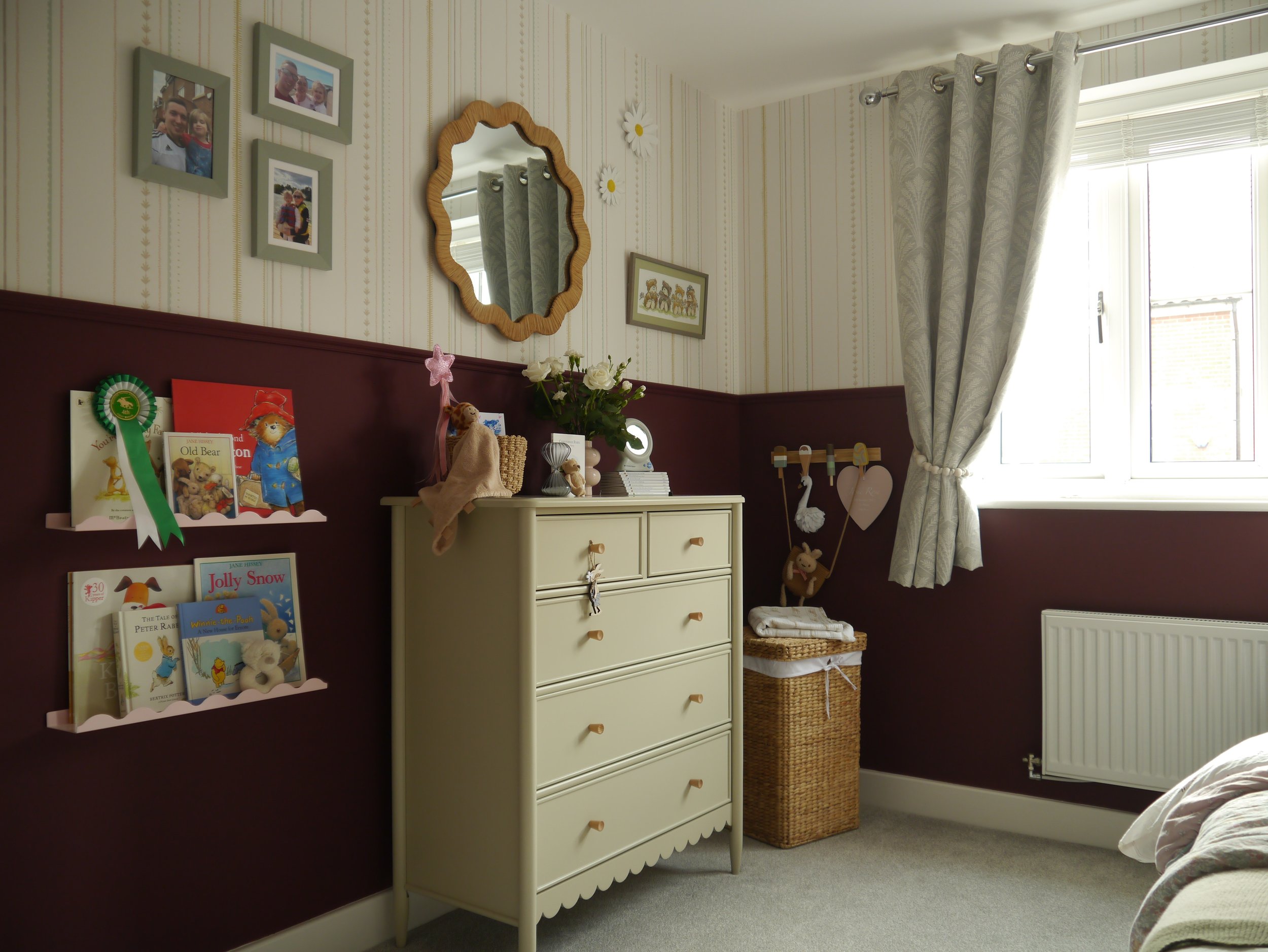 Girl's room with dark walls and striped wallpaper