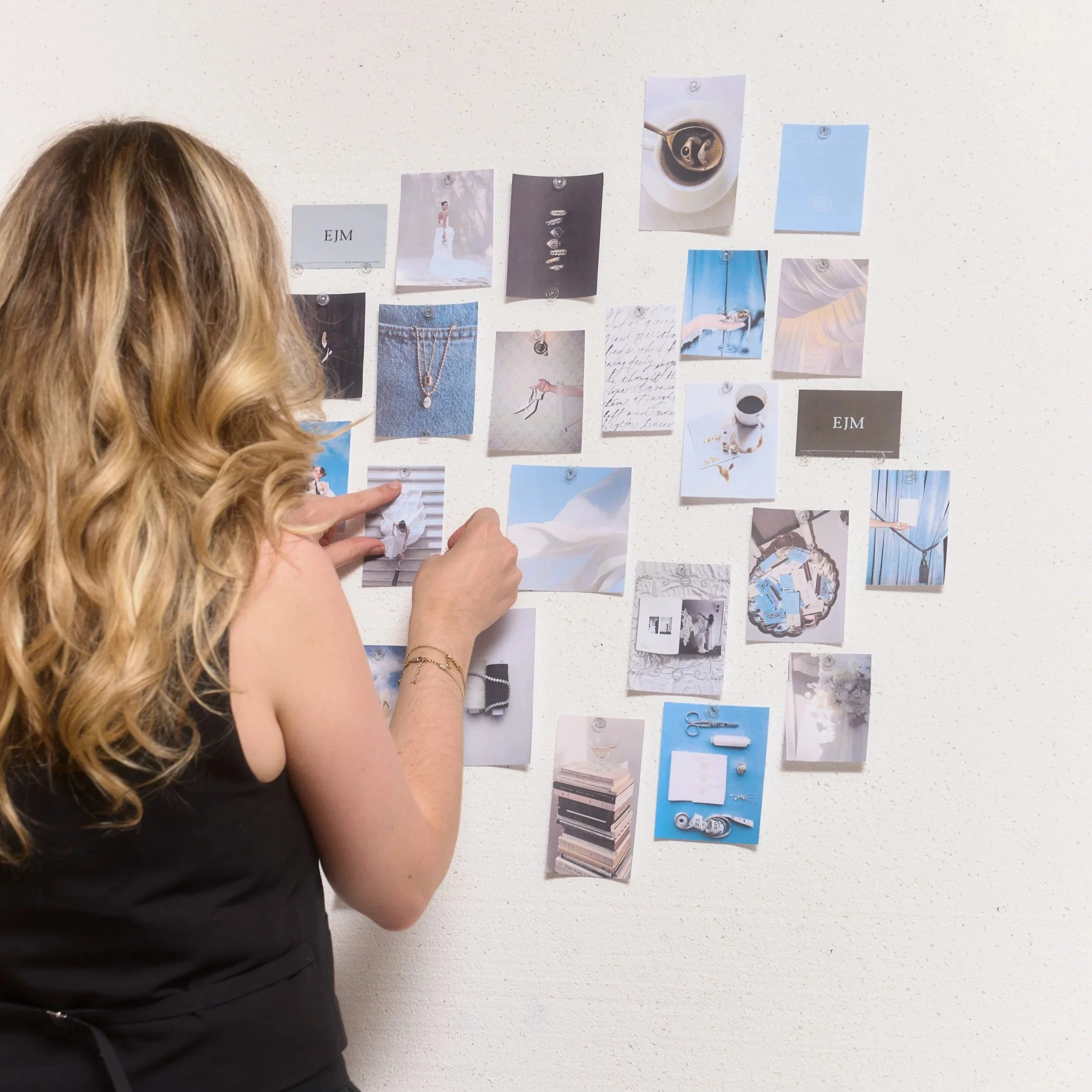 Emma MacLachlan reviewing a mood board of brand imagery