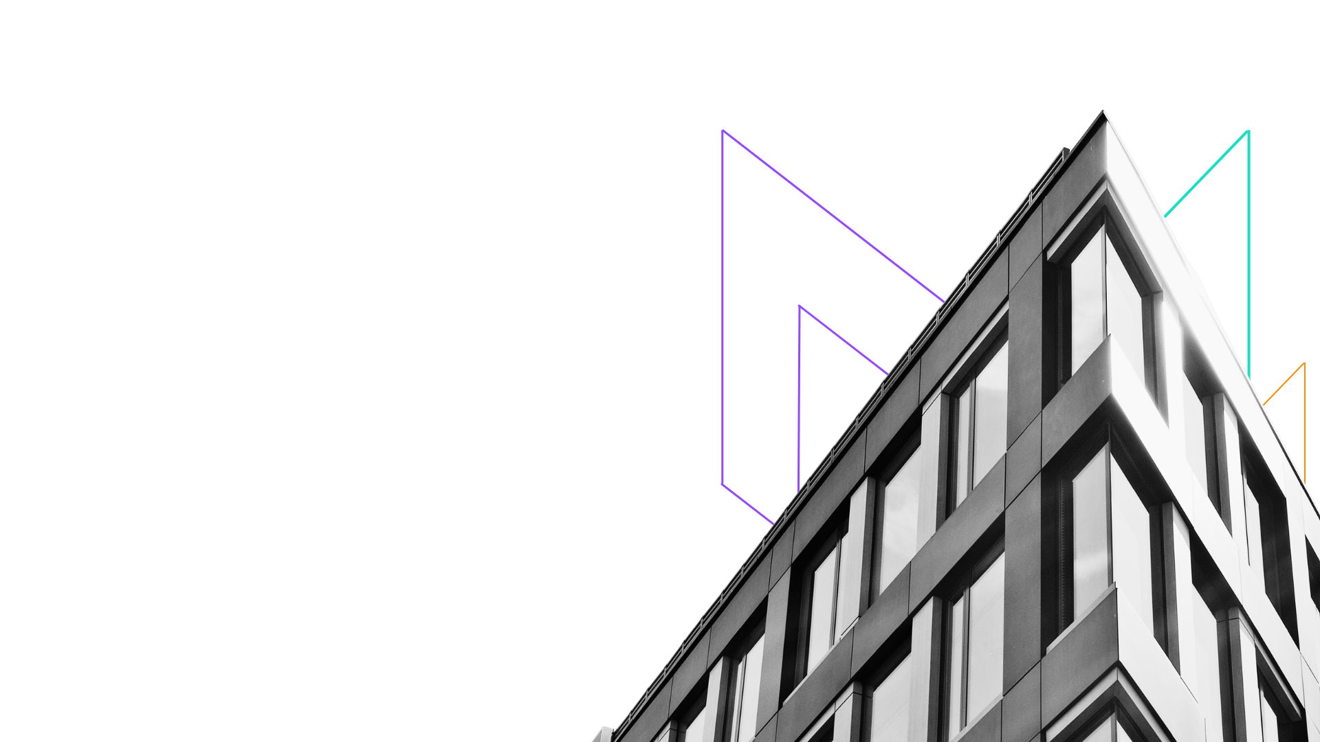 Black and white modern building with large windows and colorful geometric shapes on the corner.