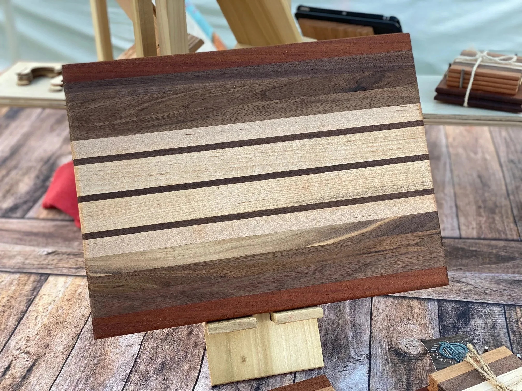 Finished cutting board with walnut, mahogany, and maple woods. 