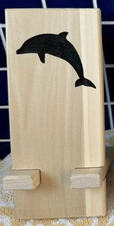 Phone stand laser engraved: dolphin