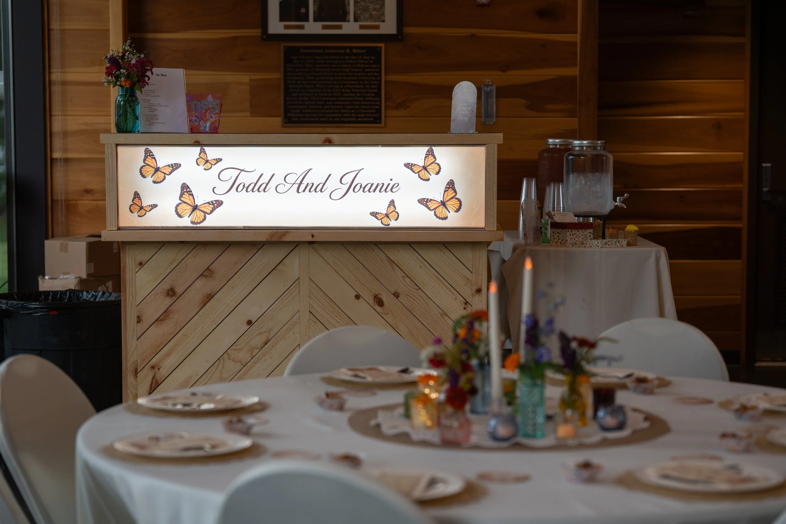Custom wood bar with a personalized lighted name banner for the happy couple