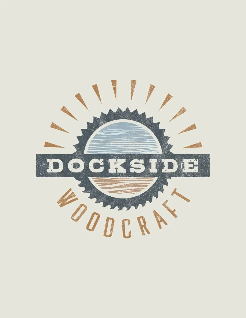 Logo for Dockside Woodcraft featuring a circular saw blade, a stylized sunset or sunrise over water, with "DOCKSIDE" across the center and "WOODCRAFT" curved below.
