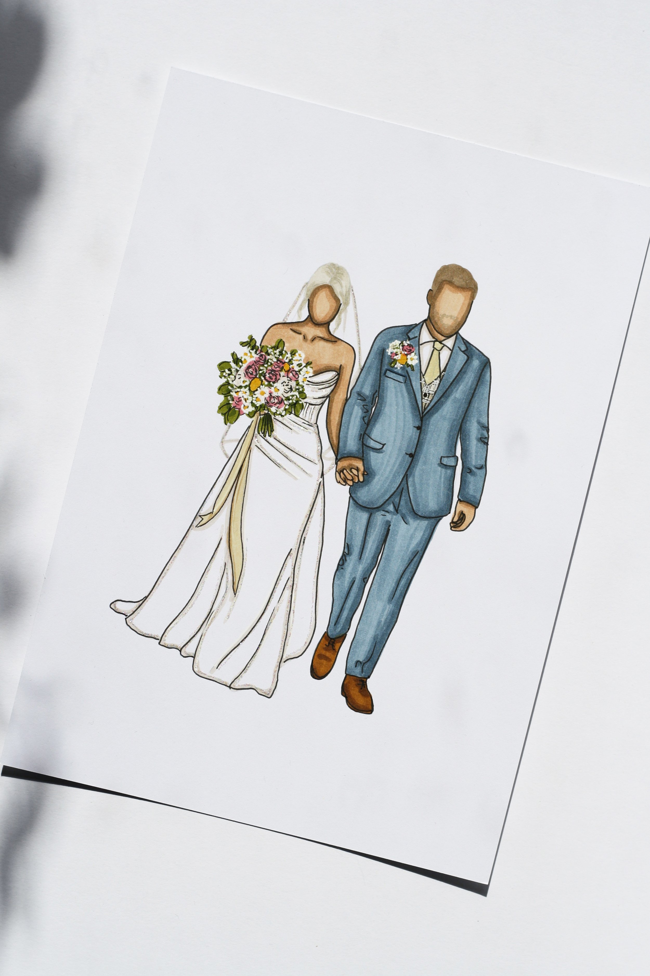 Illustration of a bride and groom holding hands, with the bride in a white gown holding a bouquet of flowers, and the groom in a blue suit, both faceless.