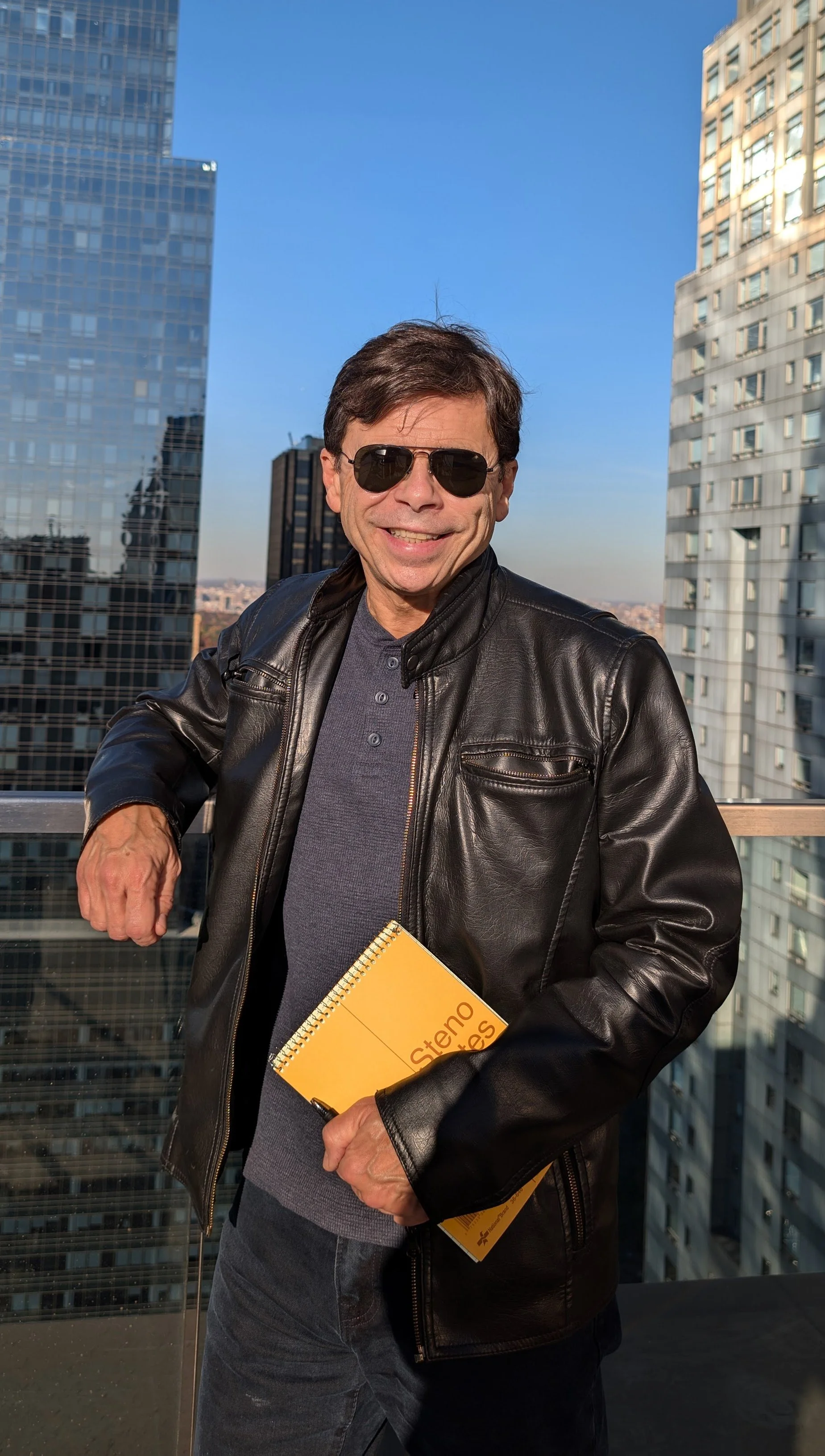Mike Rezendes takes in the view from a New York rooftop just before an interview for his book on Jimmy Breslin.