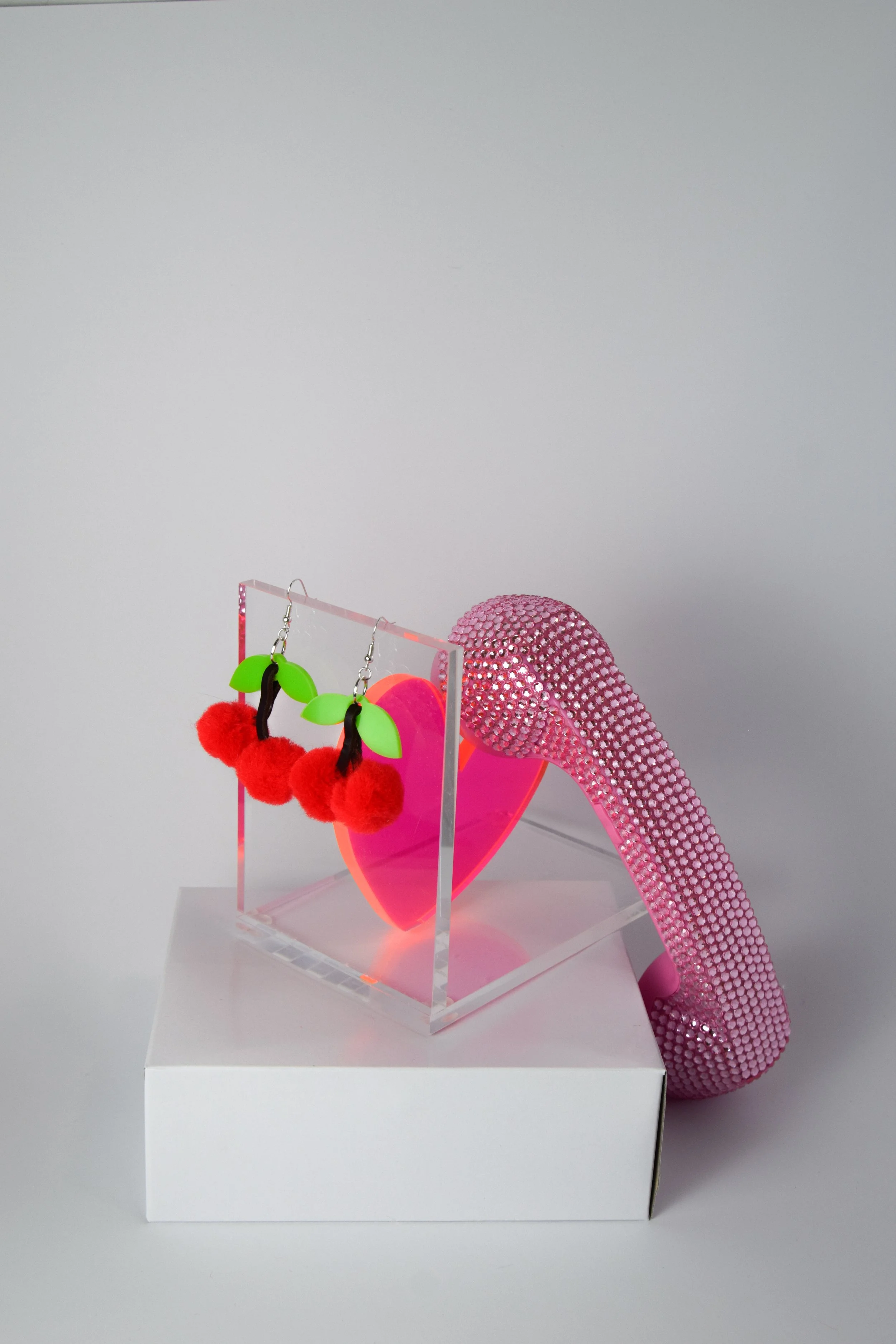 Cherry Pom Pom Earrings by So Camp! With Heart Bookend and Phone.jpg