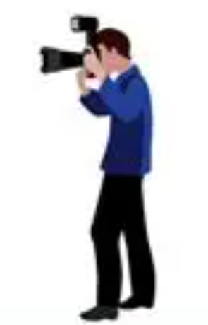 A person in a blue jacket and black pants looking through a video camera.