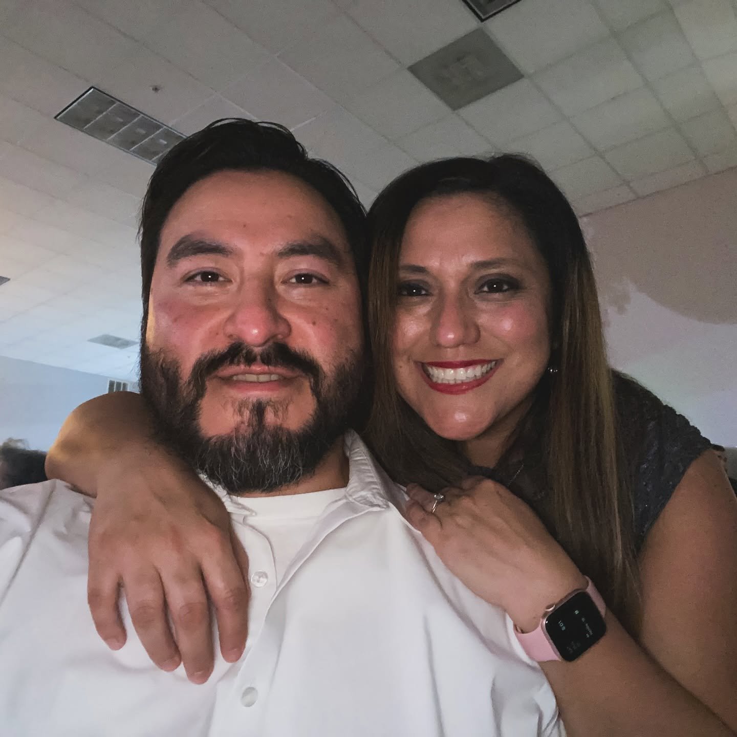 John and Debbie, owners and founders of Memories Out Loud audio guestbook rentals, smiling together.