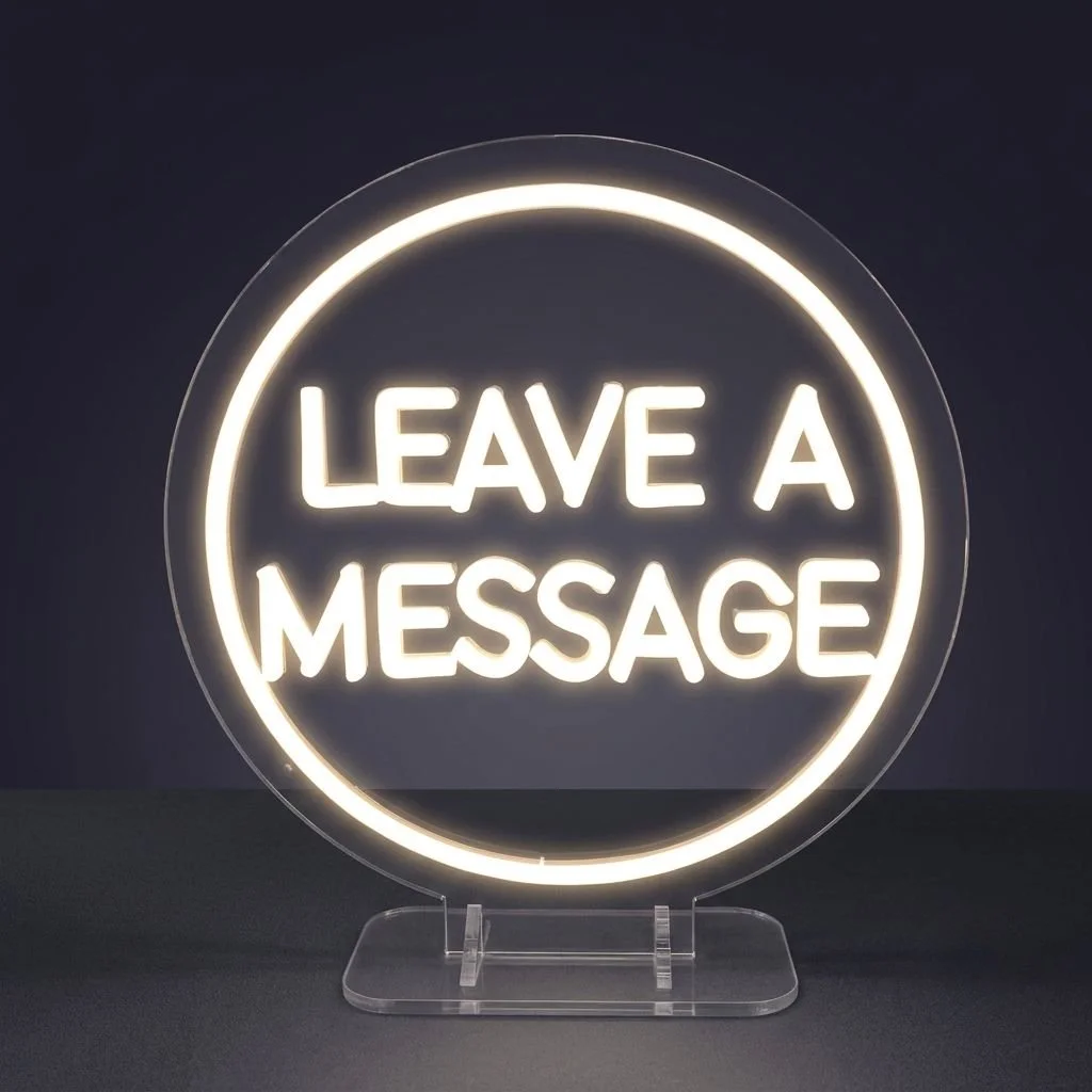 Acrylic display stand for audio guestbook services. Circular neon sign with 'LEAVE A MESSAGE' in block letters.