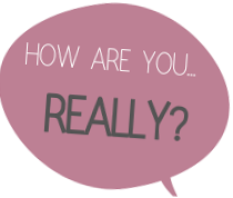 A large banner with the text "How are you, really?" hanging on a brick building. The banner also displays the words "The NUE Co" and a smaller sign reading "Overall Murals" at the bottom.