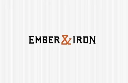 Logo for Ember & Iron with black and orange text on a white background.