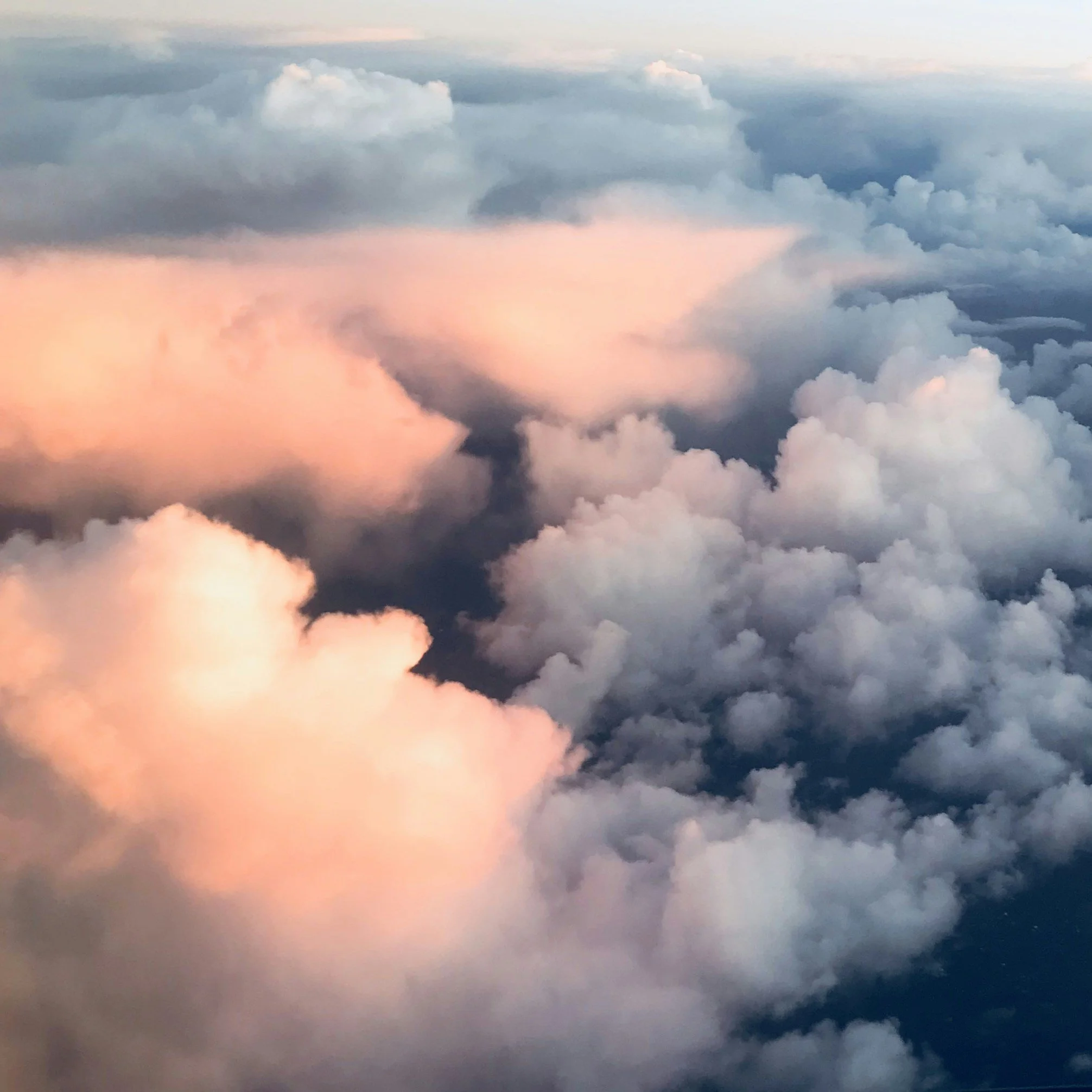 Clouds during sunset with warm pink and orange hues
