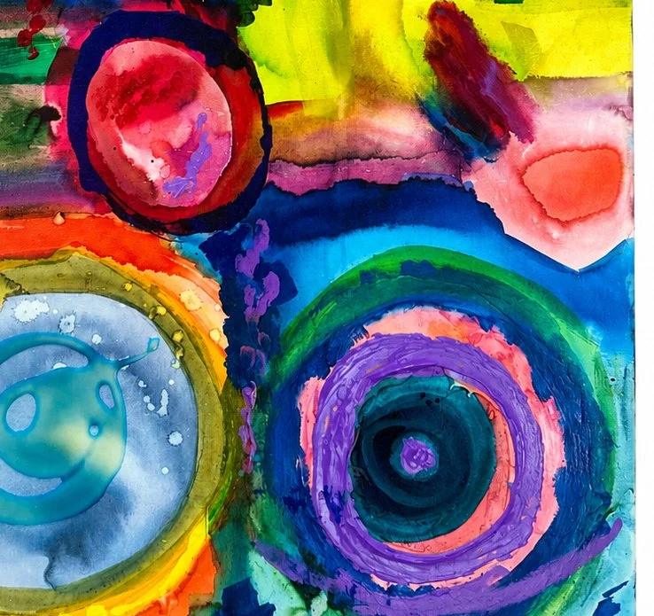 Colorful abstract watercolor painting with concentric circles and vibrant colors including red, blue, yellow, green, purple, and pink.