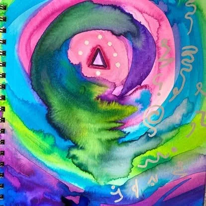 Colorful abstract watercolor painting with a pink heart in the center, green, blue, purple, and pink swirls, and a triangle inside the heart.