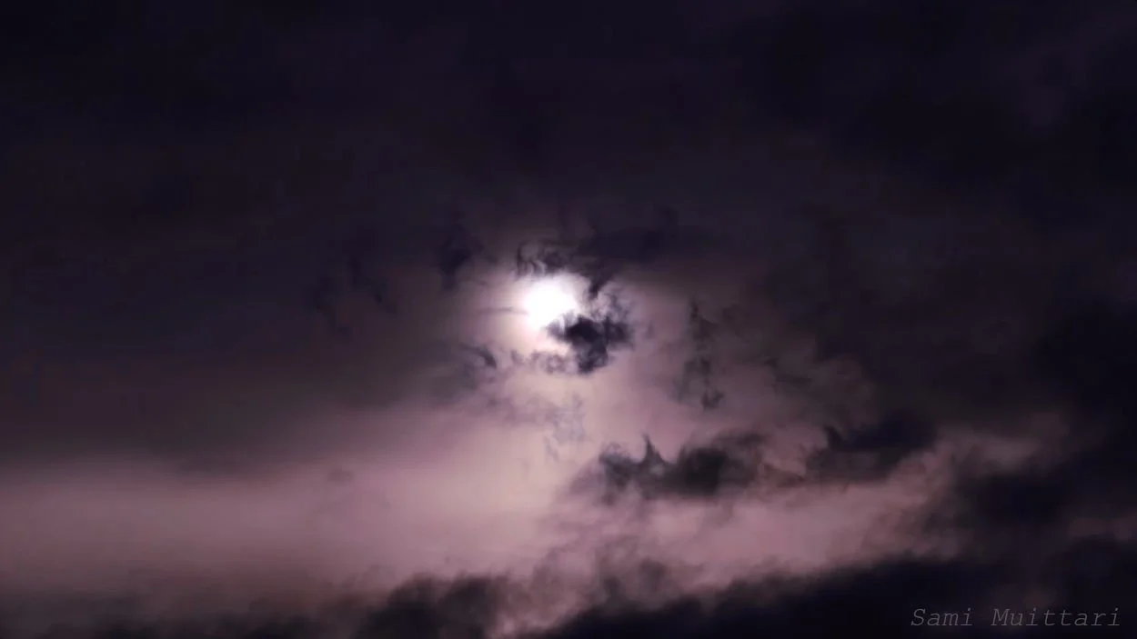 Midnight glow: Moonbeams through Laukaa clouds