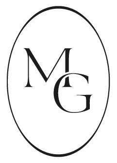 A black oval-shaped logo with the letters 'M' and 'G' intertwined inside.