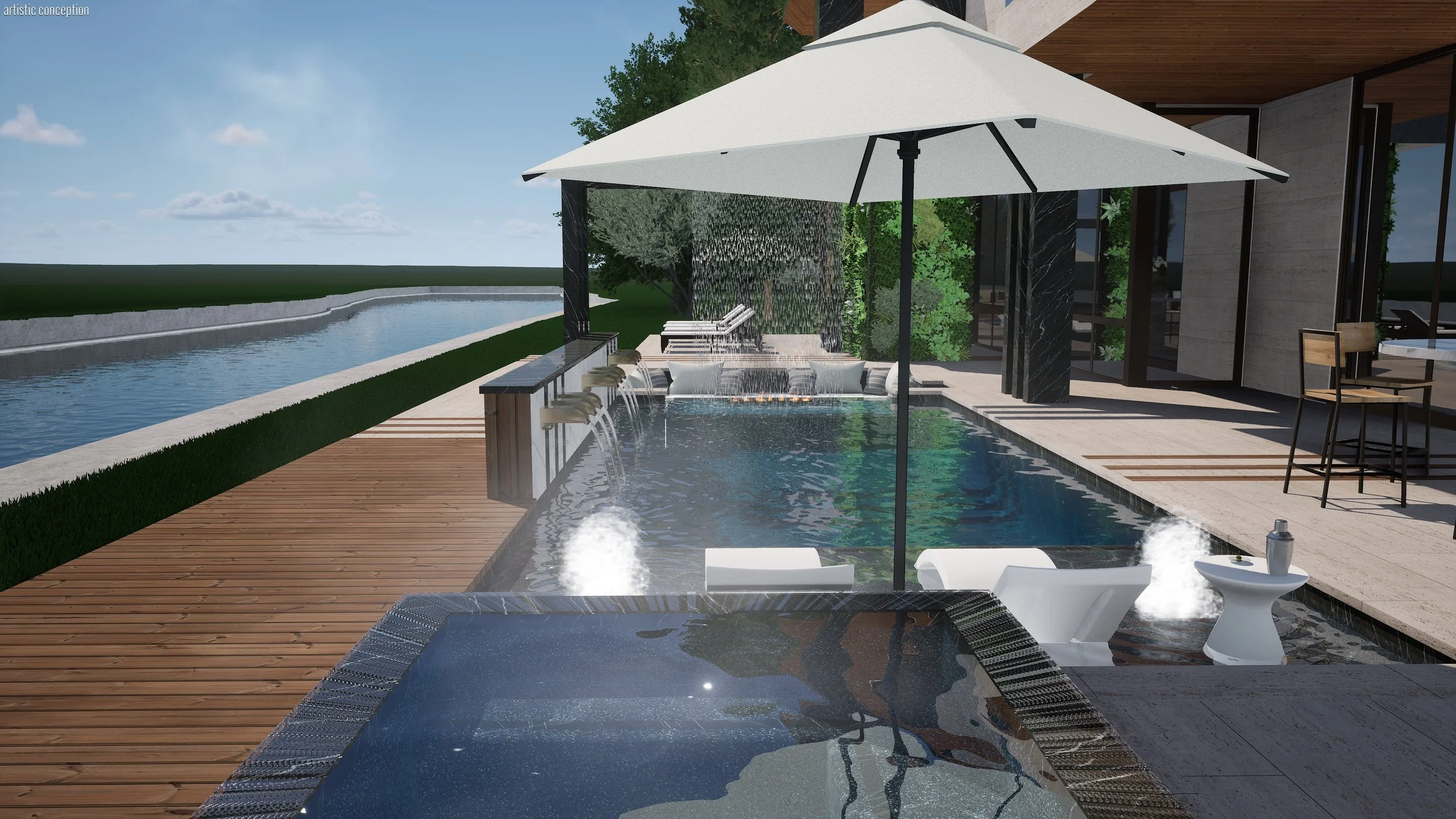 Modern outdoor pool area with wooden deck, umbrella, water features, and seating, overlooking a body of water and trees in the background.