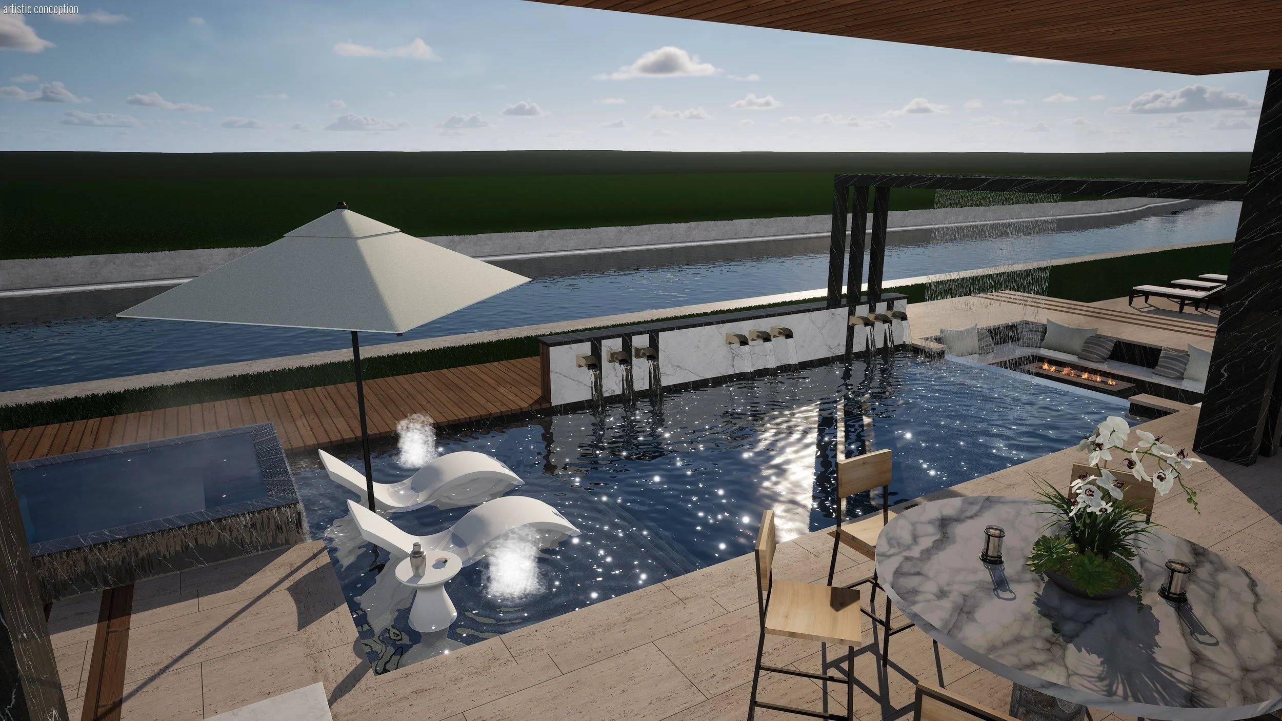 Luxury outdoor pool area with lounge chairs, umbrellas, a fire pit, and a water feature, overlooking a grassy landscape under a partly cloudy sky.