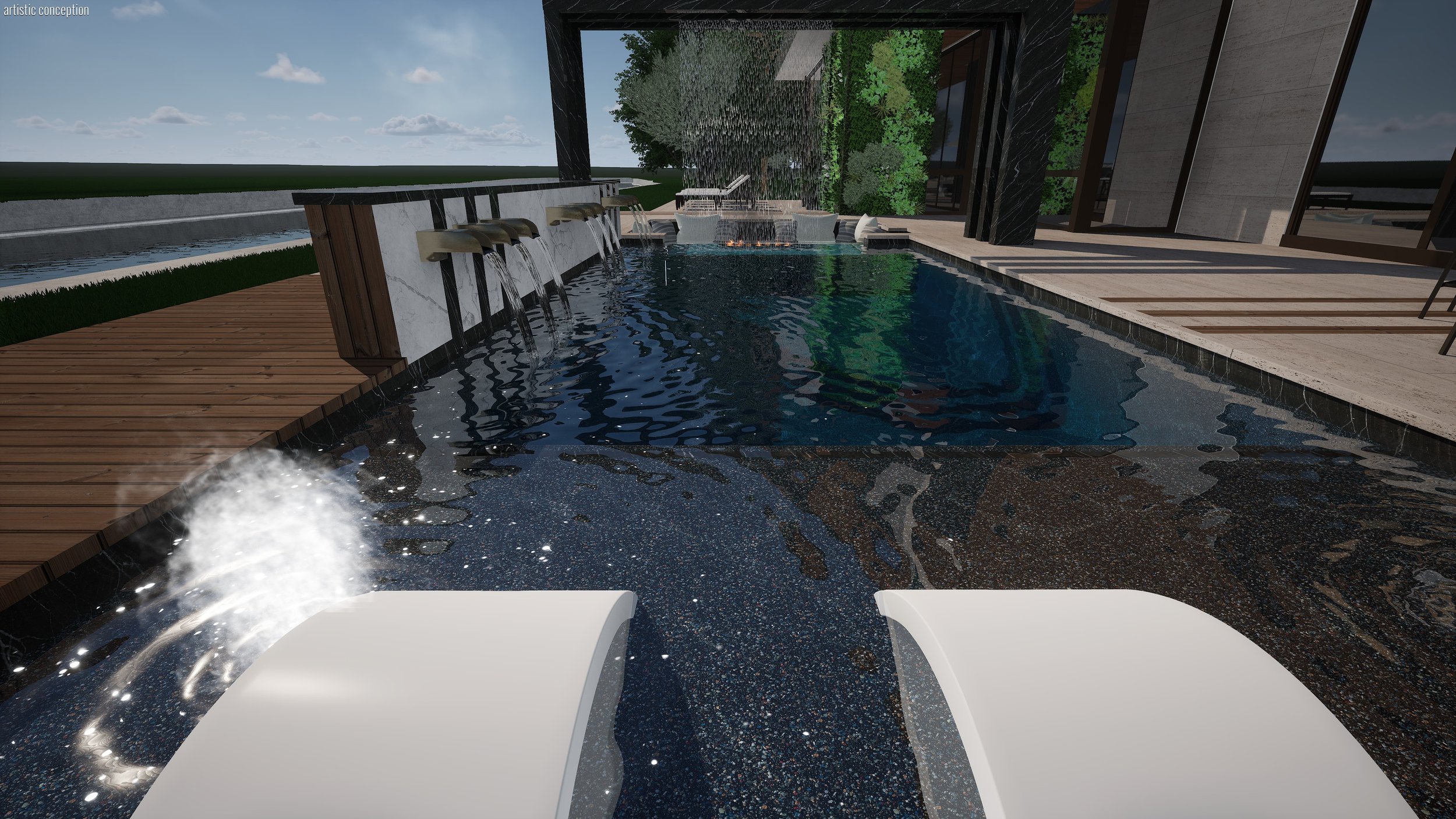 Modern outdoor pool area with waterfall features, wooden decking, lush green plants, and a sitting area with lounge chairs, overlooking a body of water under a partly cloudy sky.