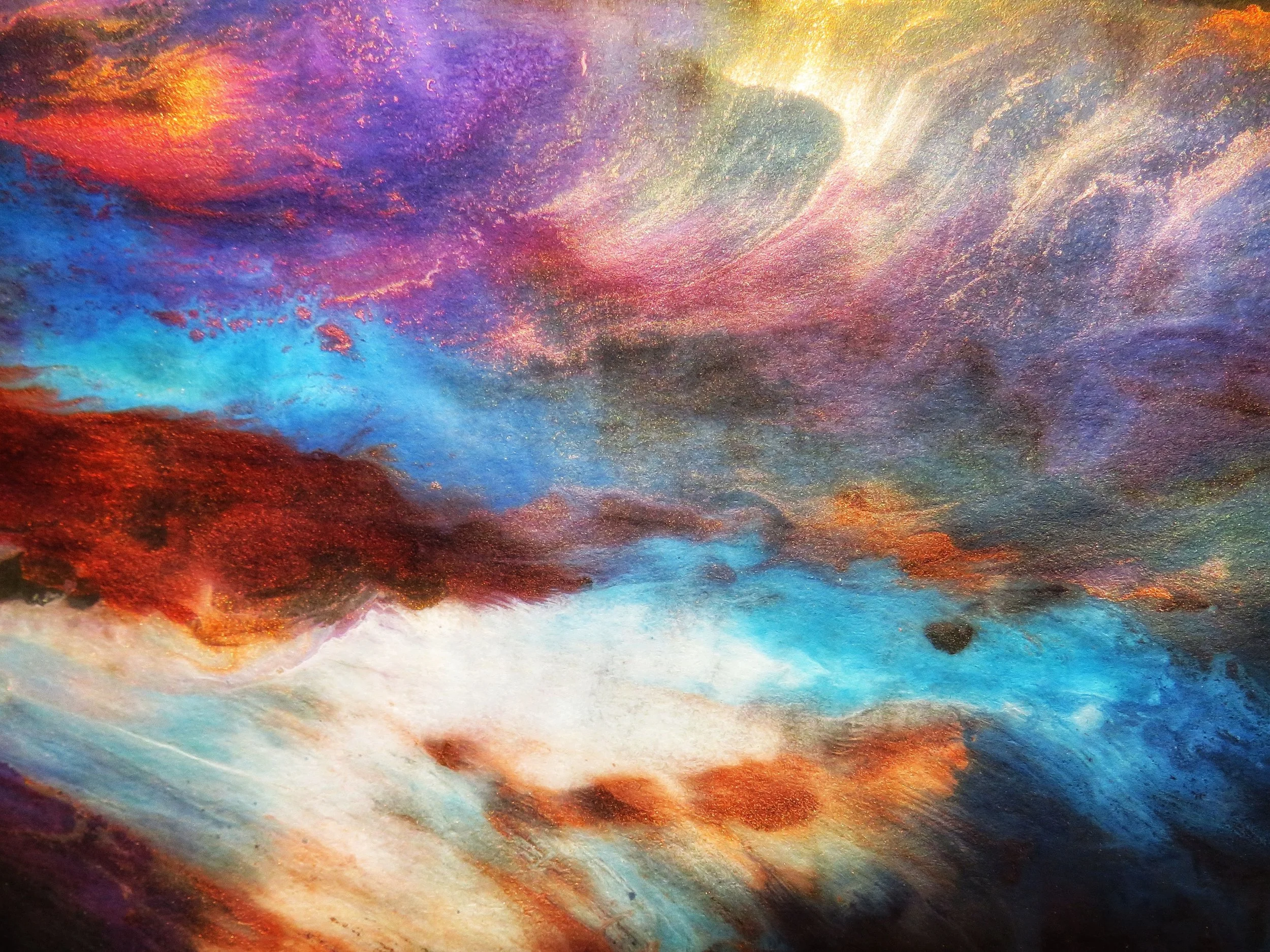 Abstract swirling sky in warm orange, red and purple tones, evoking a sense of transcendence.