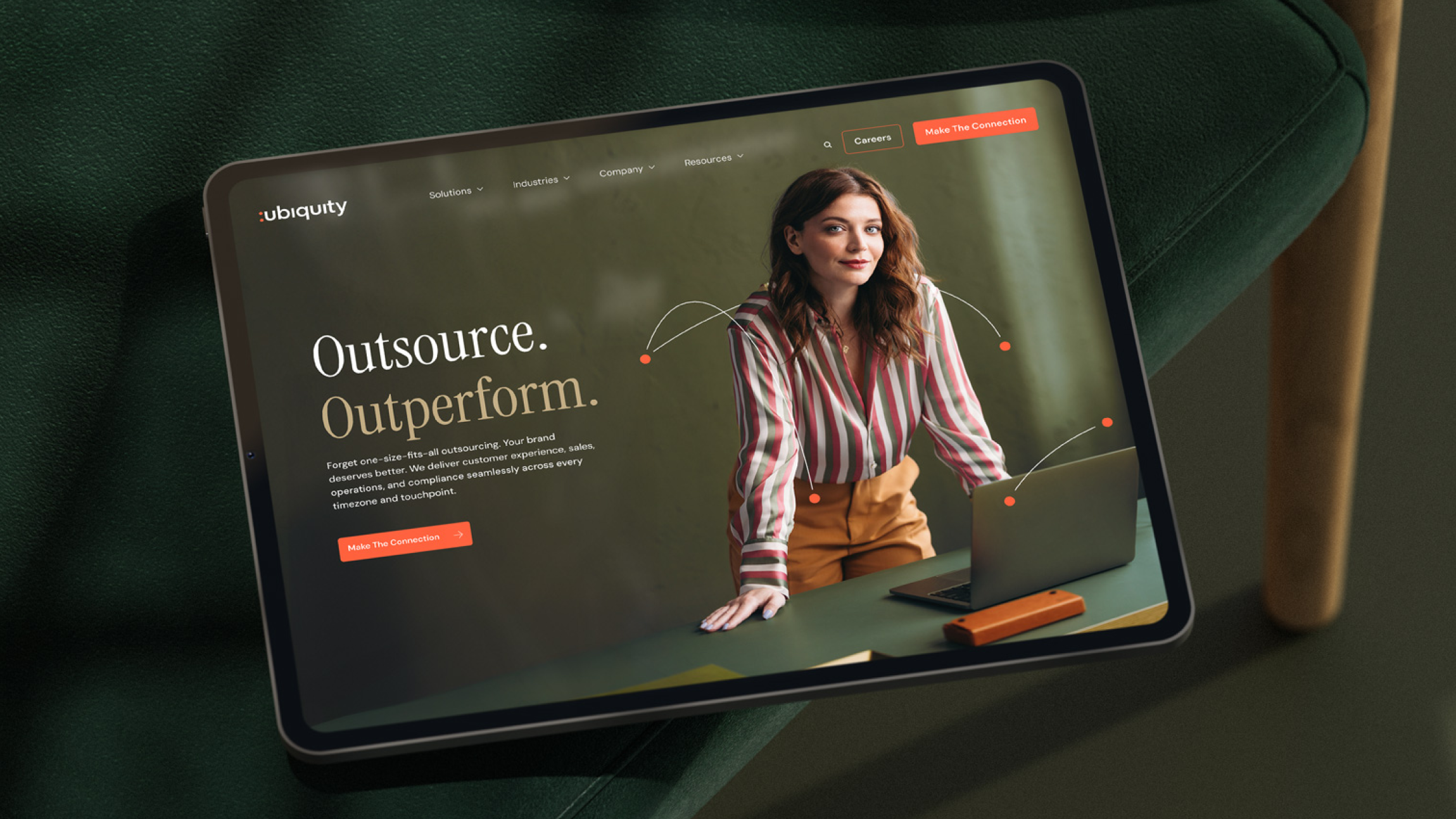A tablet screen that displays the redesigned homepage of ubiquity.com