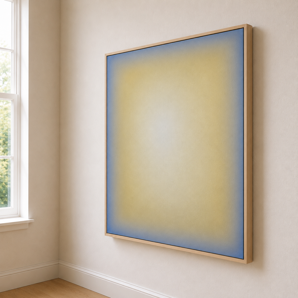 An abstract painting with yellow and blue gradient hues in a wooden frame hanging on a beige wall near a window with white trim.