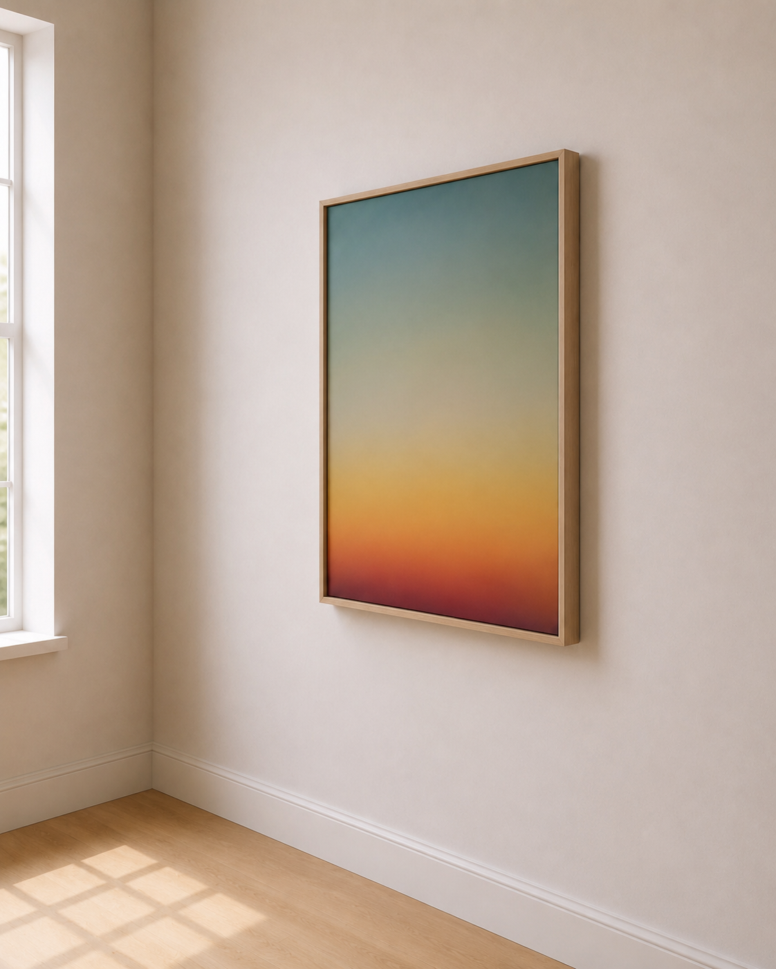 Framed abstract sunset painting hanging on a white wall in a bright room with a window and wooden floor.