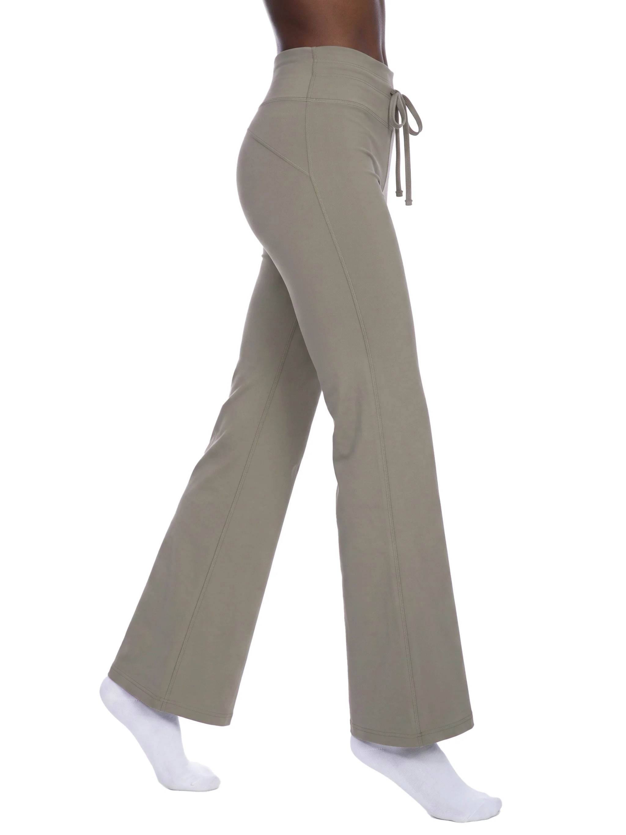 Beige wide-leg pants worn by a mannequin with white socks, set against a plain white background.