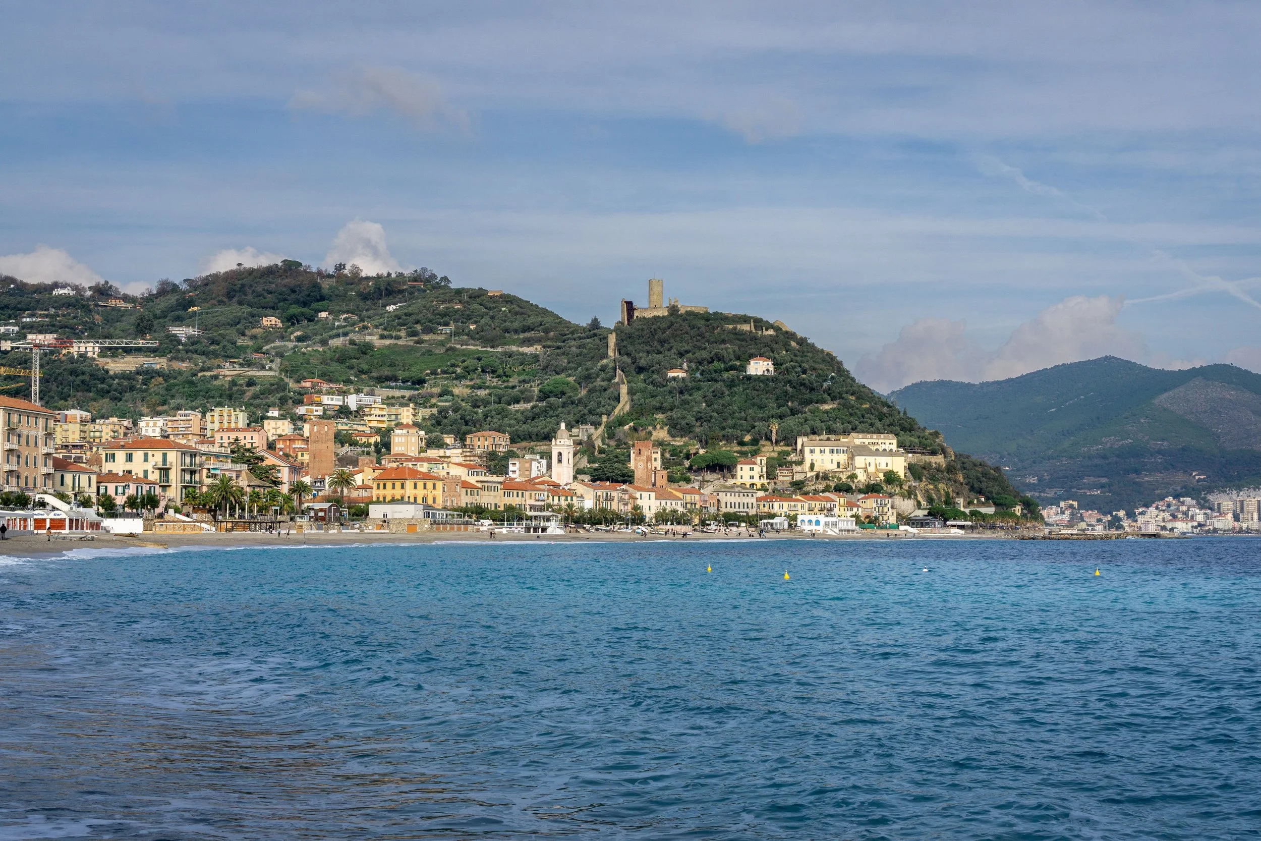 Panoramic view of Ventimiglia Old Town and the medieval hilltop fortifications along the Ligurian coast, a highlight of what to see in Liguria.