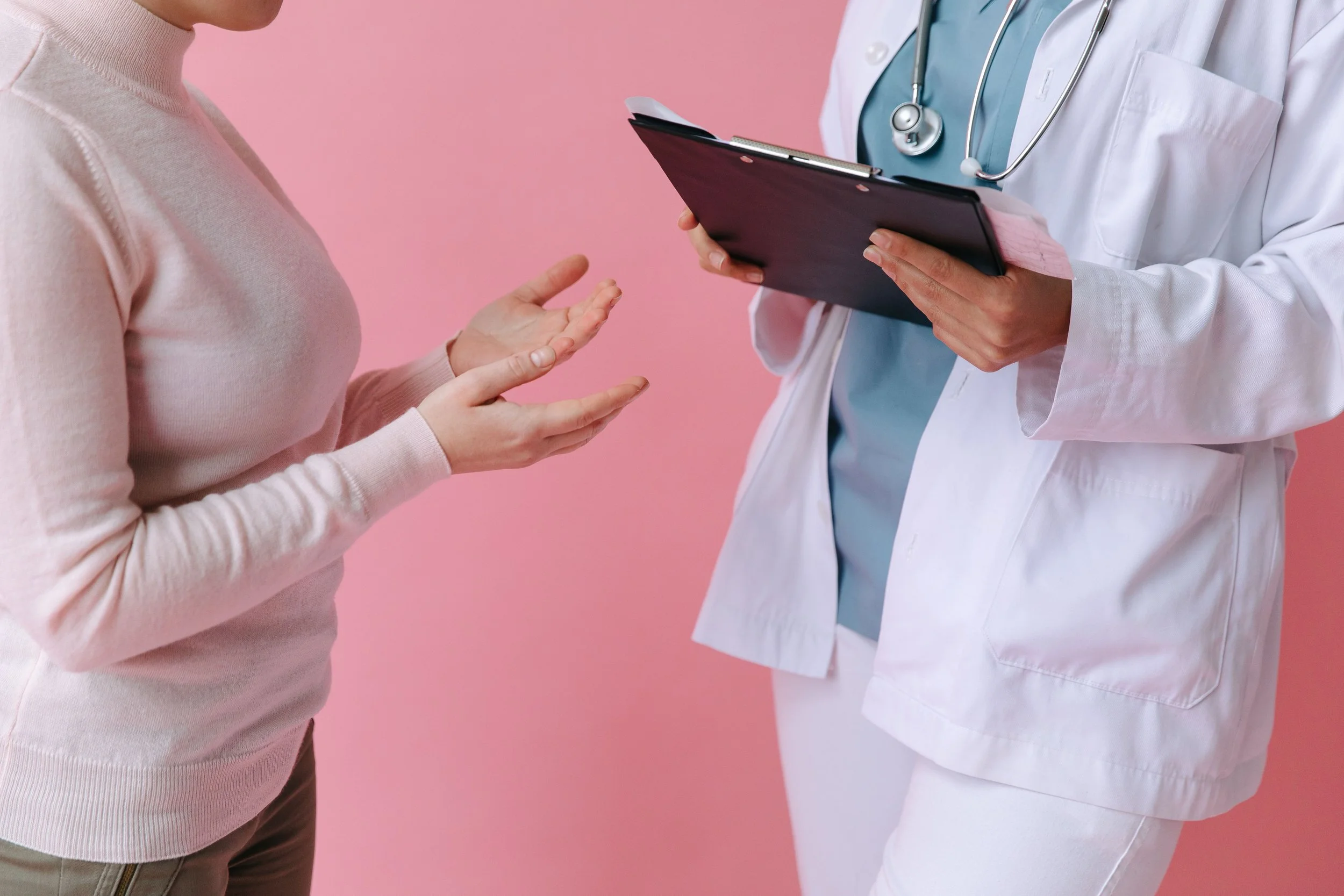 A patient explains her medical issue to a Physican Assistant