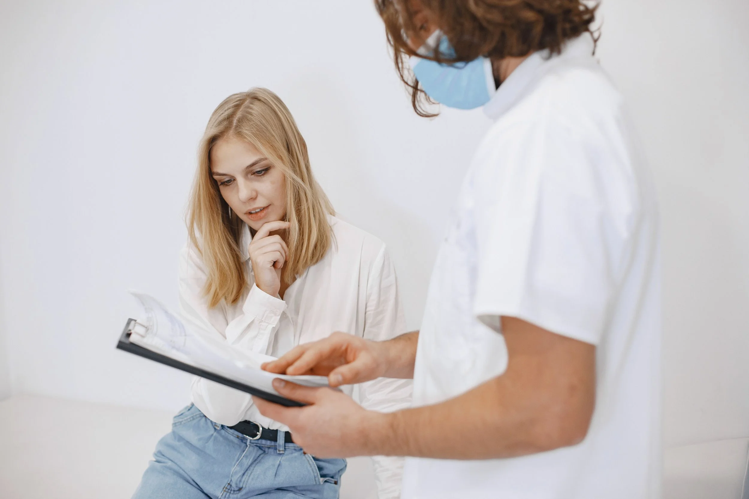 A nurse explains test results to a patient.