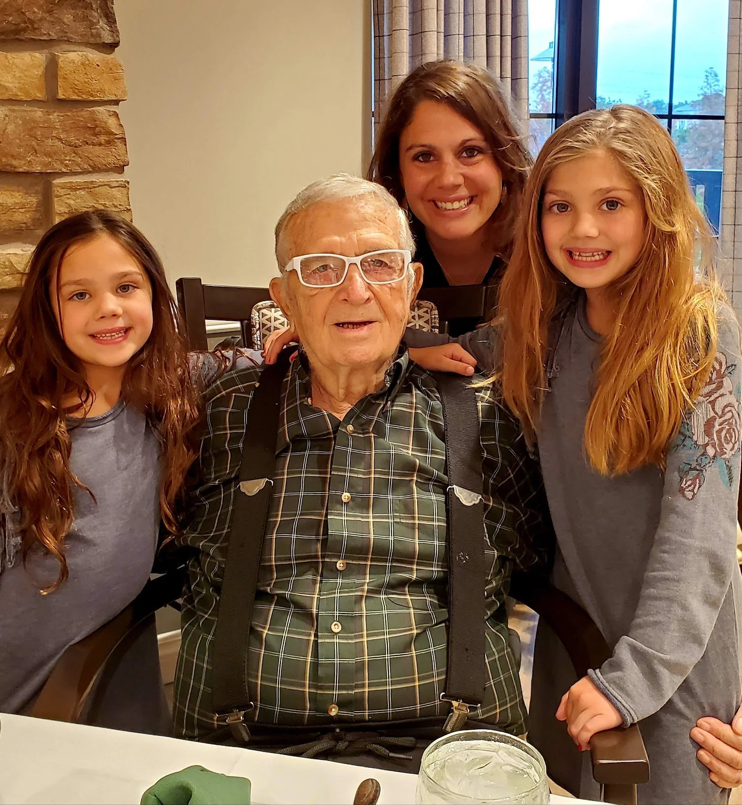 Patient Advocate Christi Jo poses with her father and two daughters.