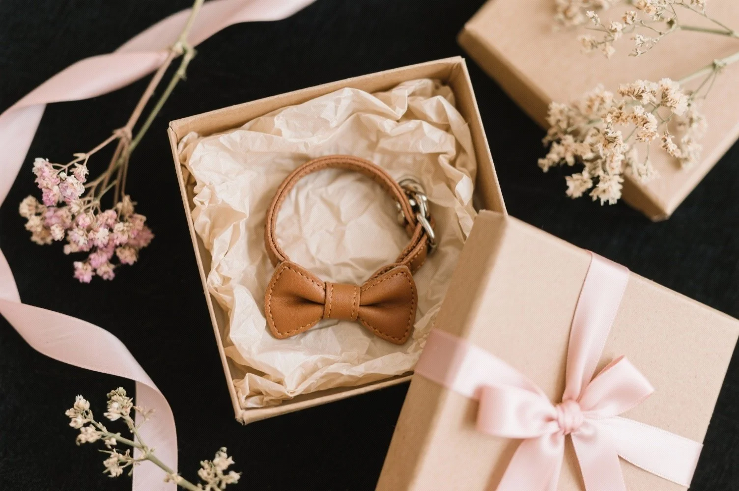 freepik__dog-collar-and-bow-in-kraft-paper-gift-box-with-ti__3547.jpeg