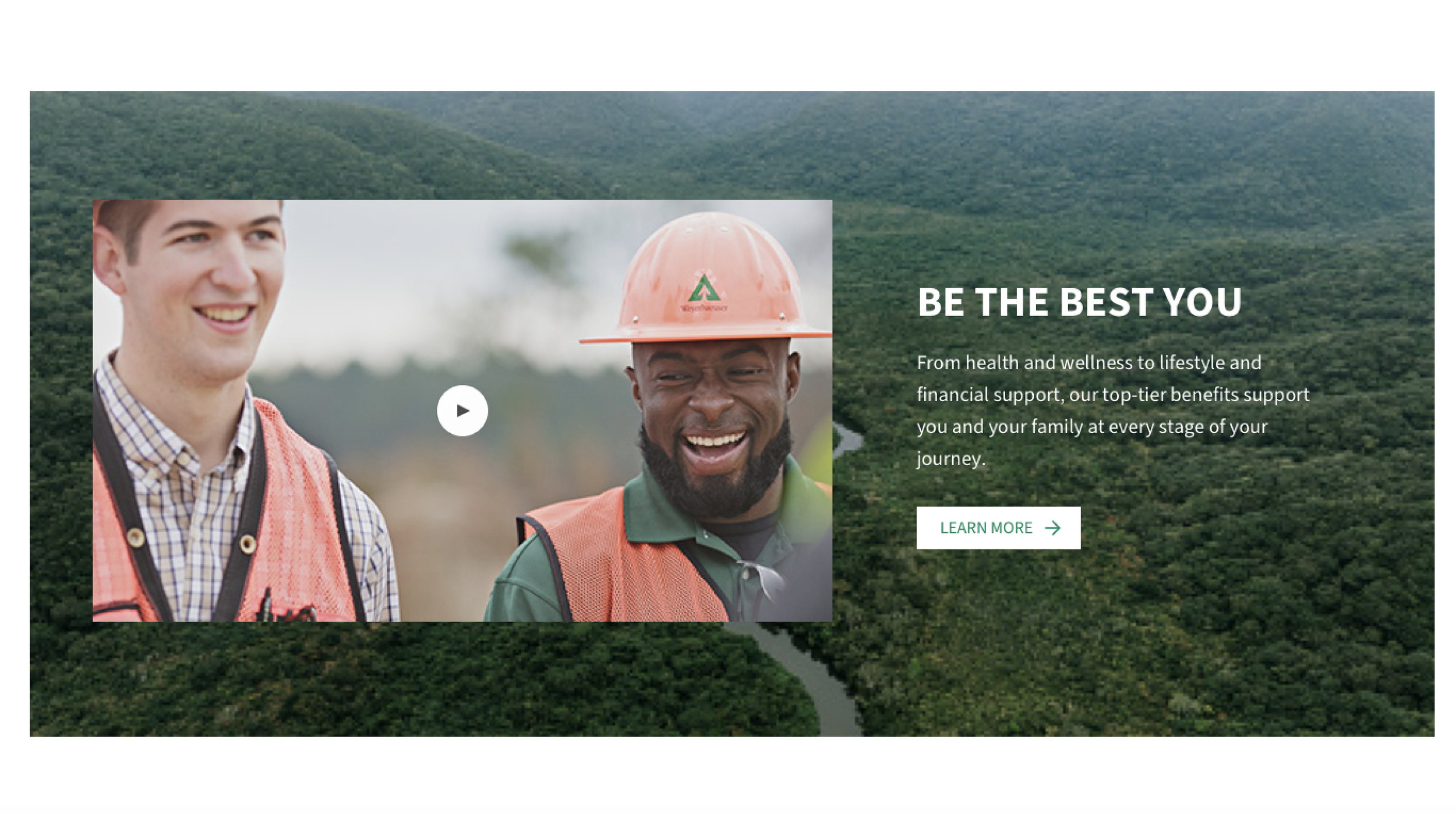Video still image of two male employees smiling