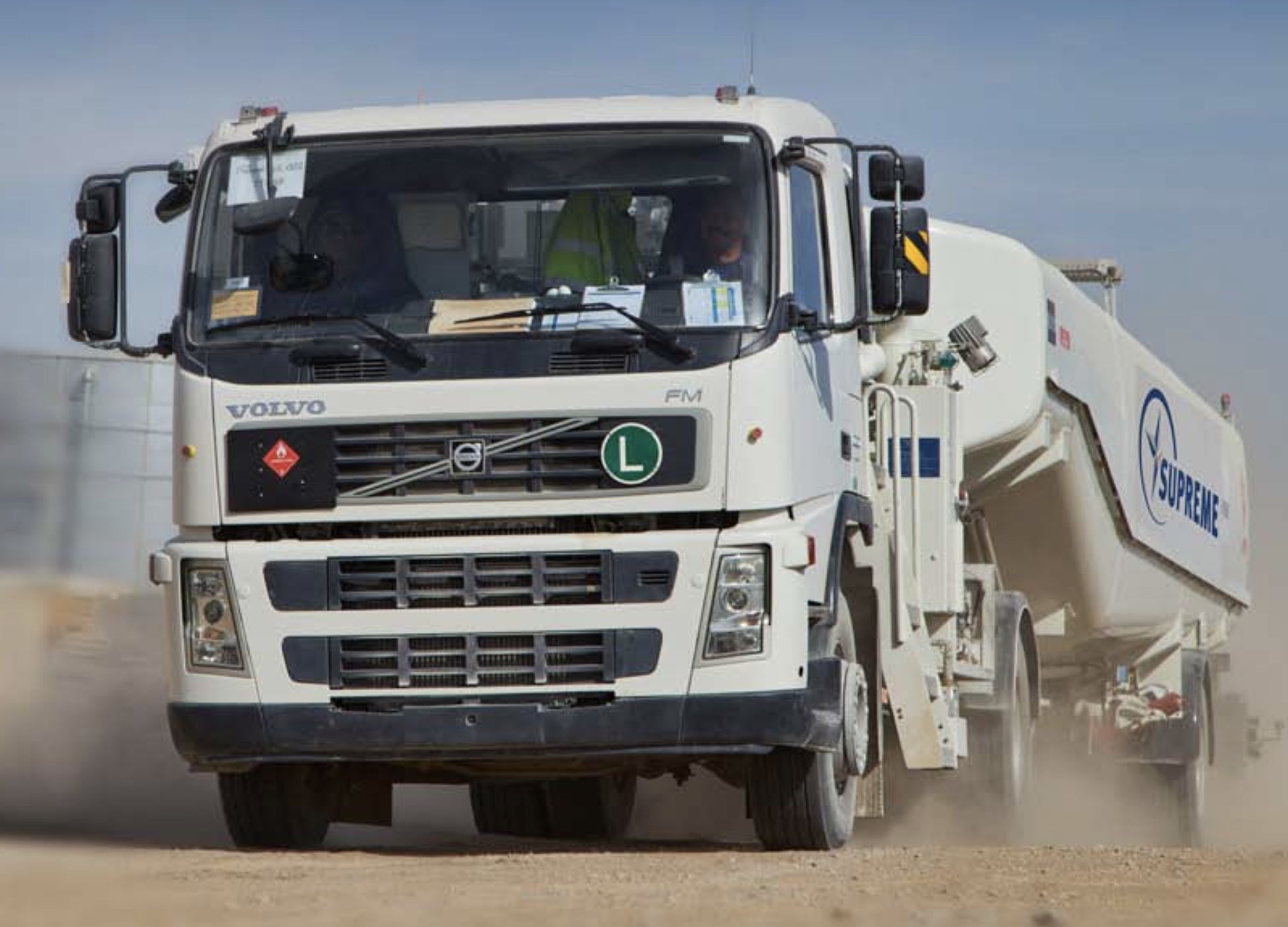 Image of truck driving through desert terrain to deliver critical goods