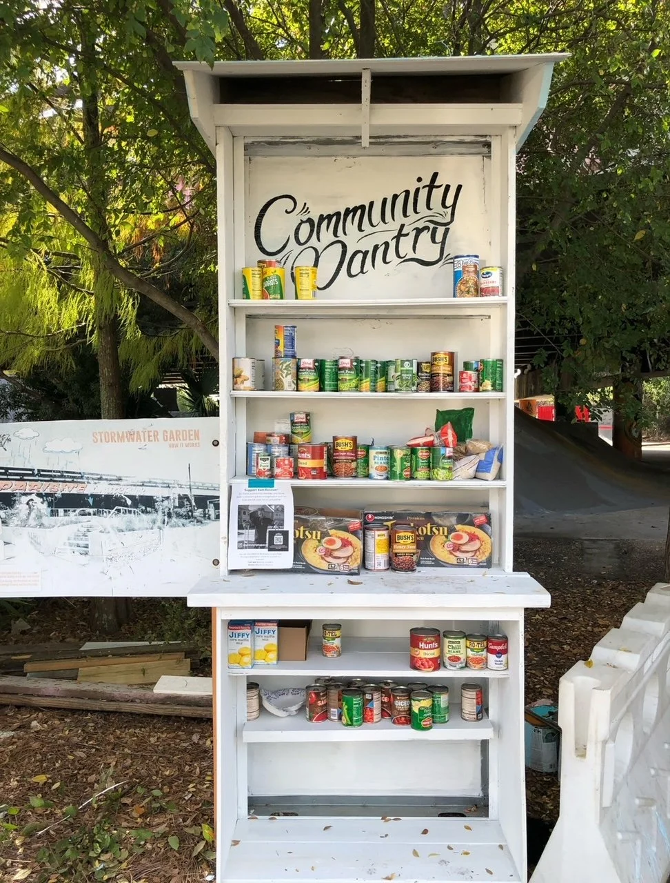 A white wooden community pantry 
built by Songbird Renovations