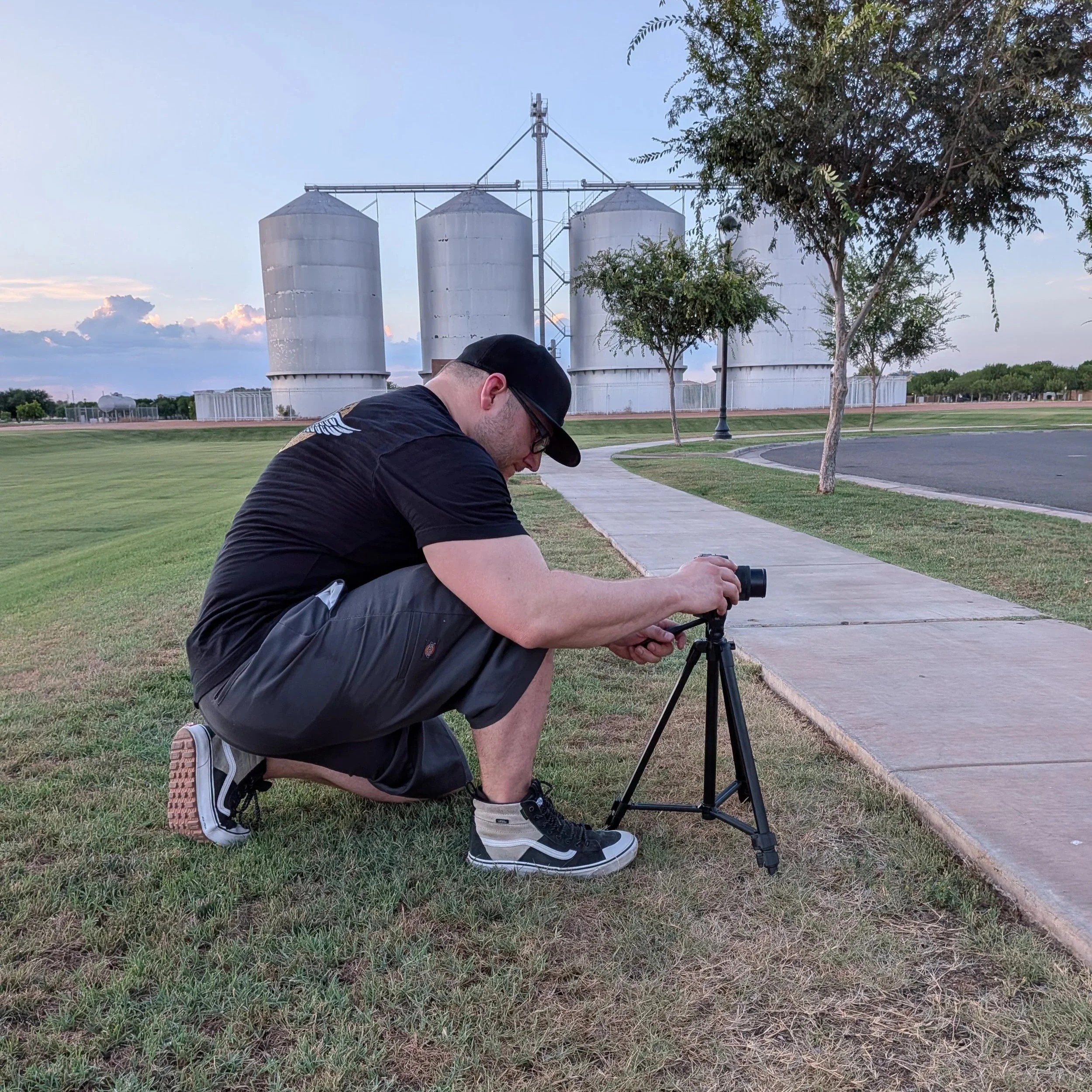 A behind-the-scenes shot of the Gasoline and Dopamine photographer taking a car picture in front of the silos in Morrison Ranch in Gilbert, AZ.