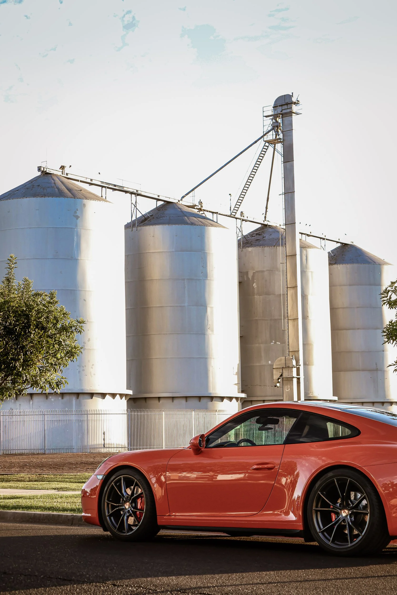 lava-orange-porsche-911-c4s-vertical-side-profile-morrison-ranch-silos-car-photography-gilbert-az-gasoline-and-dopamine.jpg