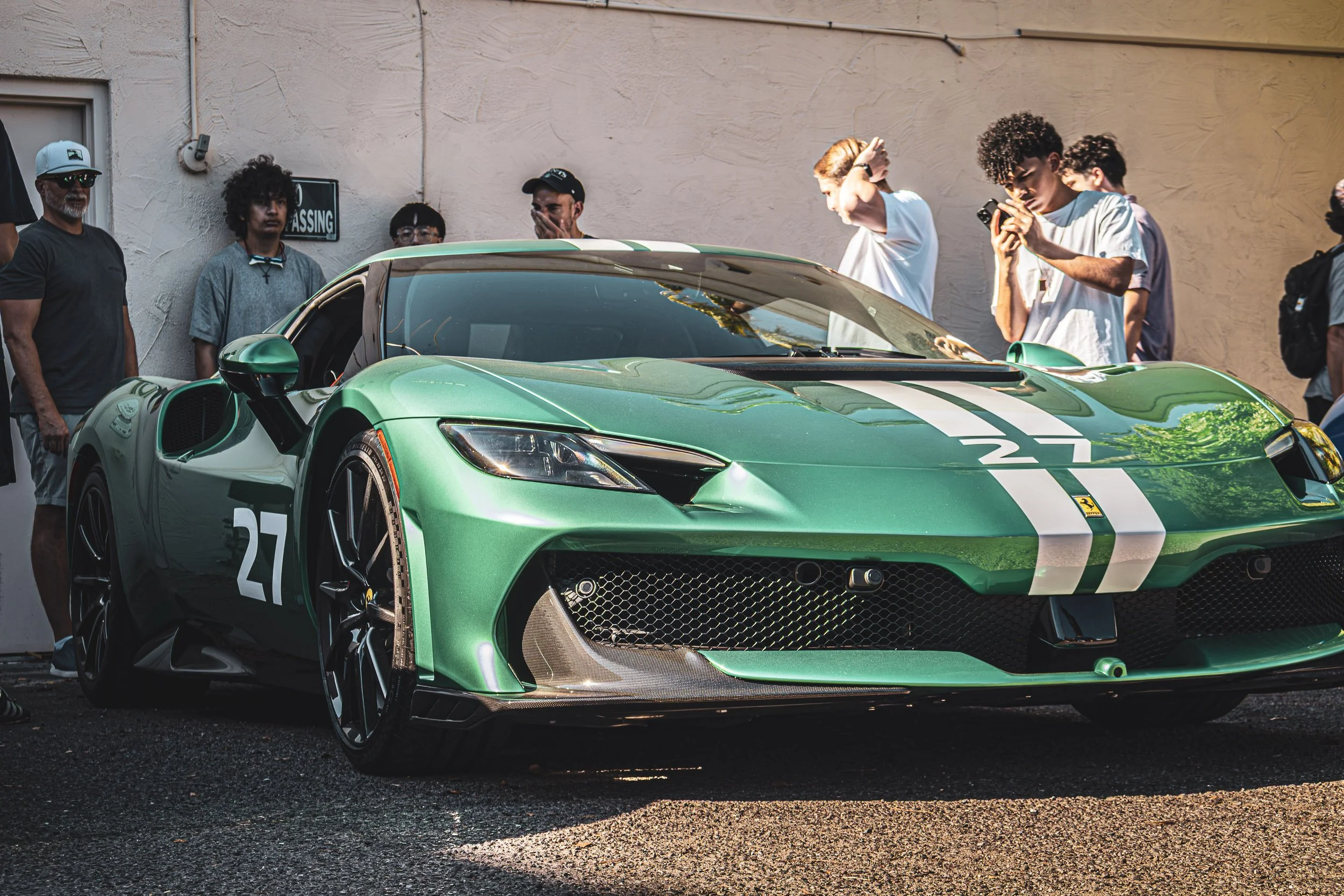 Automotive lifestyle photography capturing a crowd of enthusiasts photographing a bright green Ferrari during a weekend car meet in Scottsdale, Arizona, captured by Gasoline and Dopamine Car Photography.