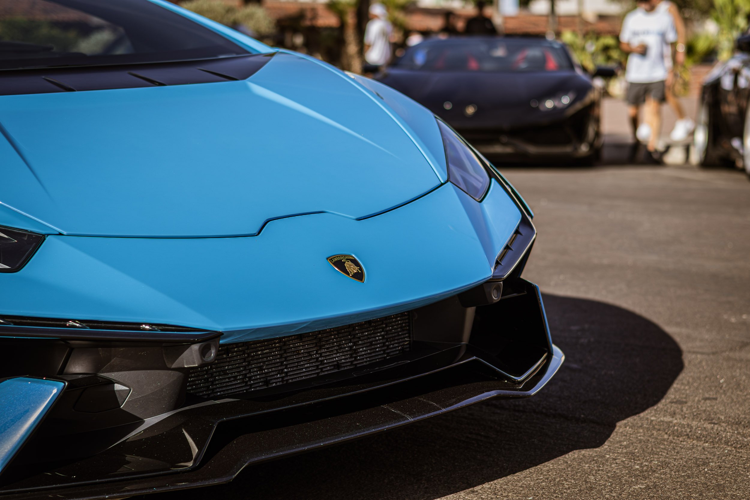 Detail car photography focusing on the aggressive angular front fascia and striking baby blue paint of a Lamborghini Aventador LP 780-4 Ultimae during a cars and coffee event in Scottsdale, Arizona, captured by Curtis from Gasoline and Dopamine.