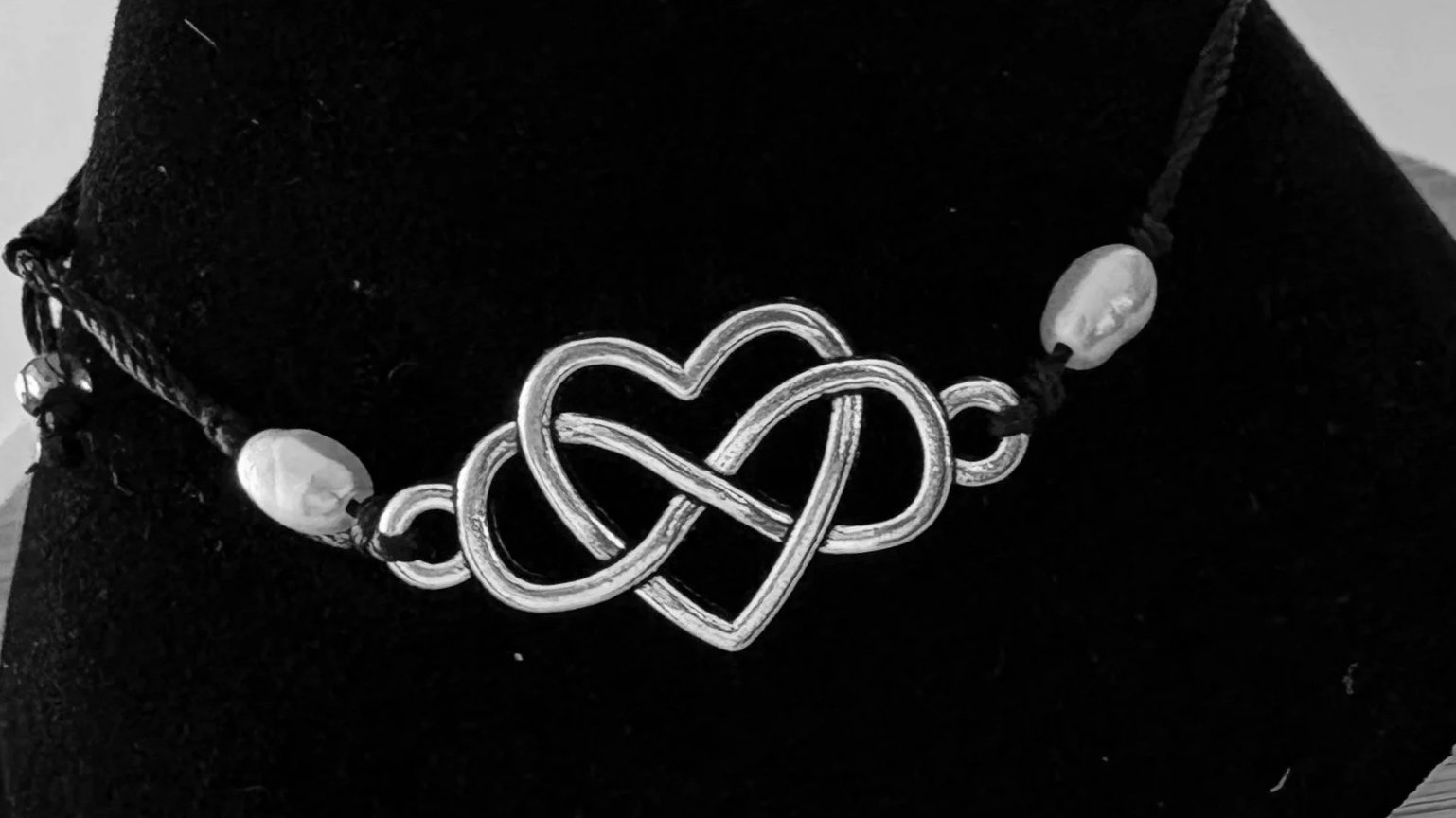 Bracelet with infinity symbol inside a heart symbolizing the infinite and eternal love of God for the individual.