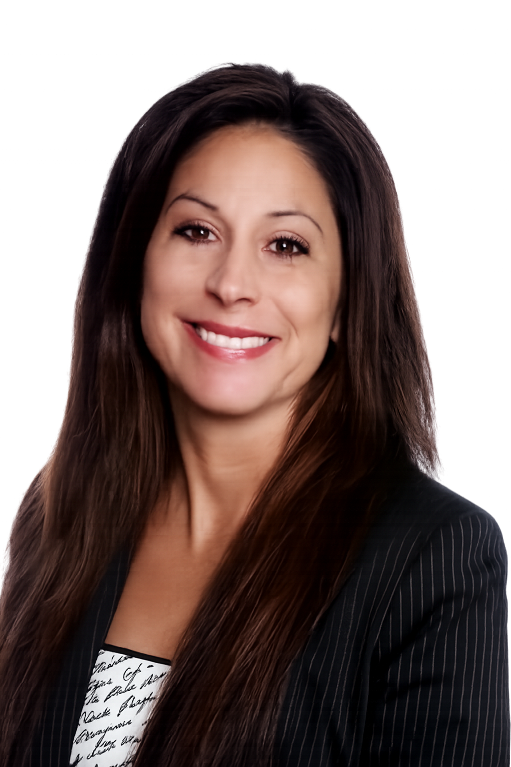 Julie Brooker, REALTOR with American Realty Group, Serving the Dallas / Fort Worth Metroplex for over 20 years, A woman with long brown hair, smiling, wearing a black pinstripe blazer over a patterned top, with a blurred background.