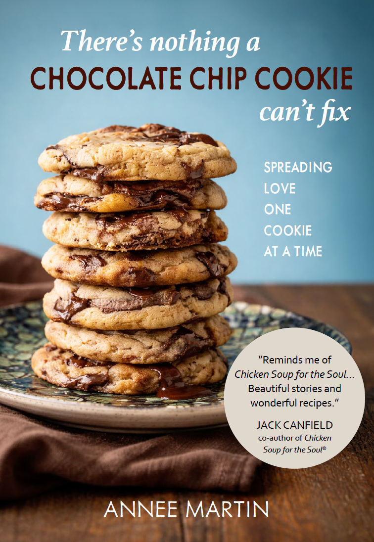 A stack of chocolate chip cookies on a decorative plate with a blue background and a brown cloth underneath. Text on the image suggests that nothing can fix a chocolate chip cookie, emphasizing spreading love one cookie at a time.