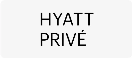 Sign with the text 'HYATT PRIVÉ' in black letters on a white background.