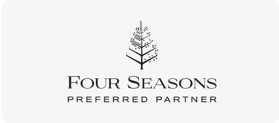 Four Seasons Preferred Partner logo featuring a stylized tree design.