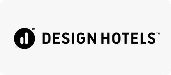 Design Hotels logo with black icon and text on a white background.