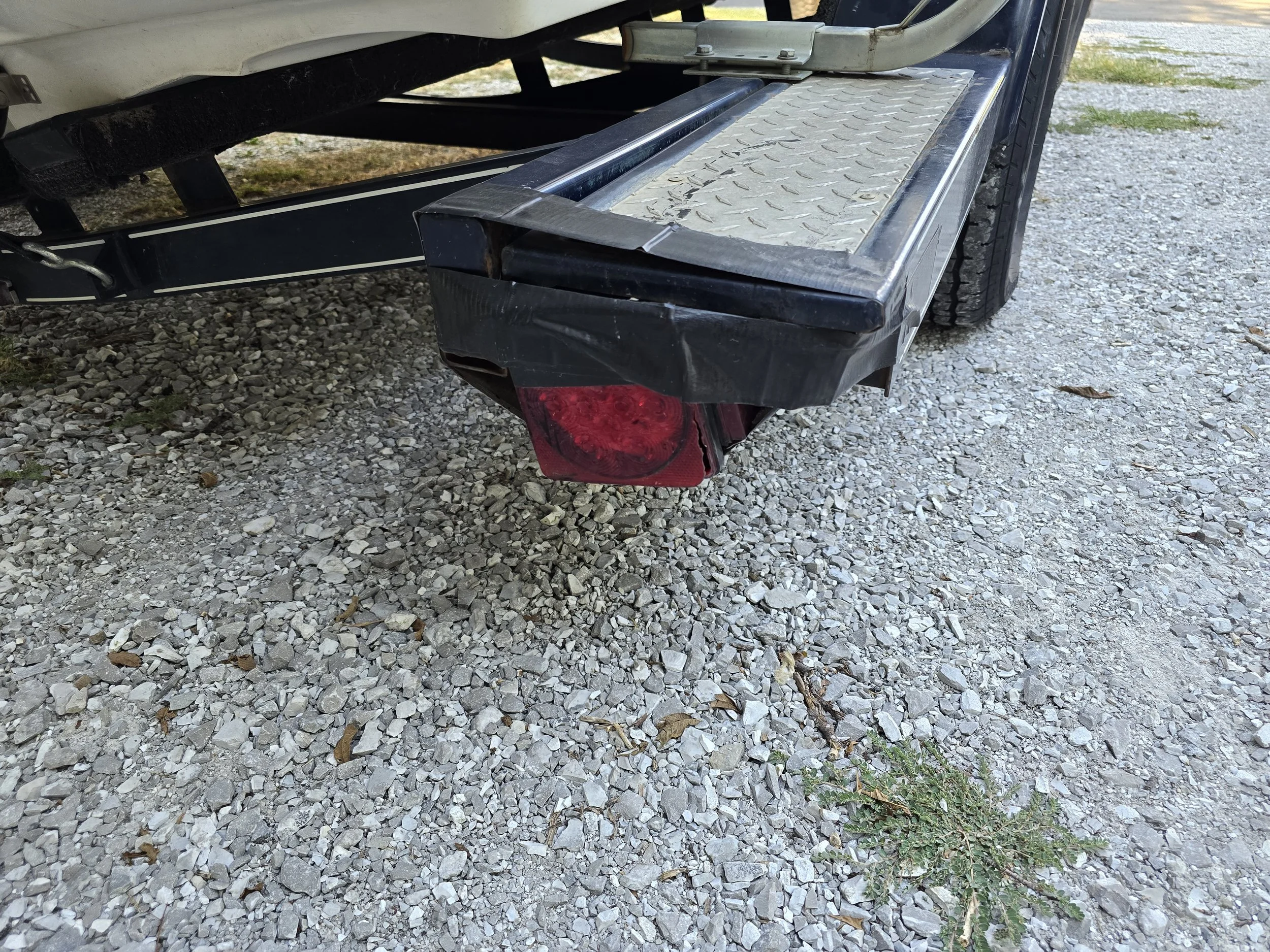 Boat trailer tail-light before being replaced.