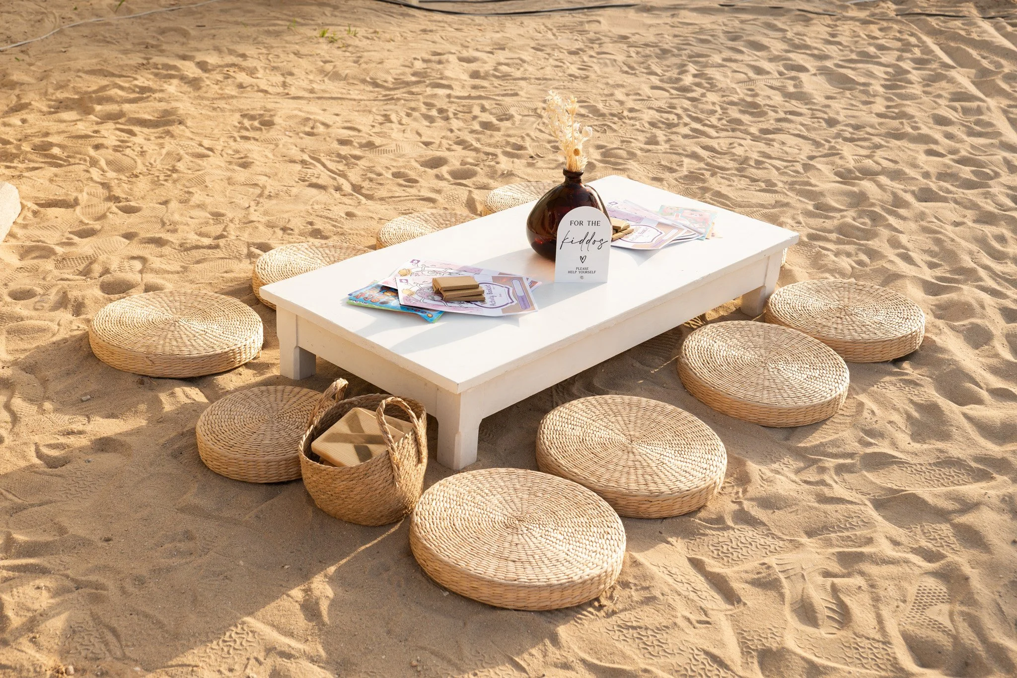 Professional hospitality photography capturing a beautifully styled beach event setup with elegant décor, showcasing outdoor venue styling and event experiences for hospitality and event brands in Malta.
