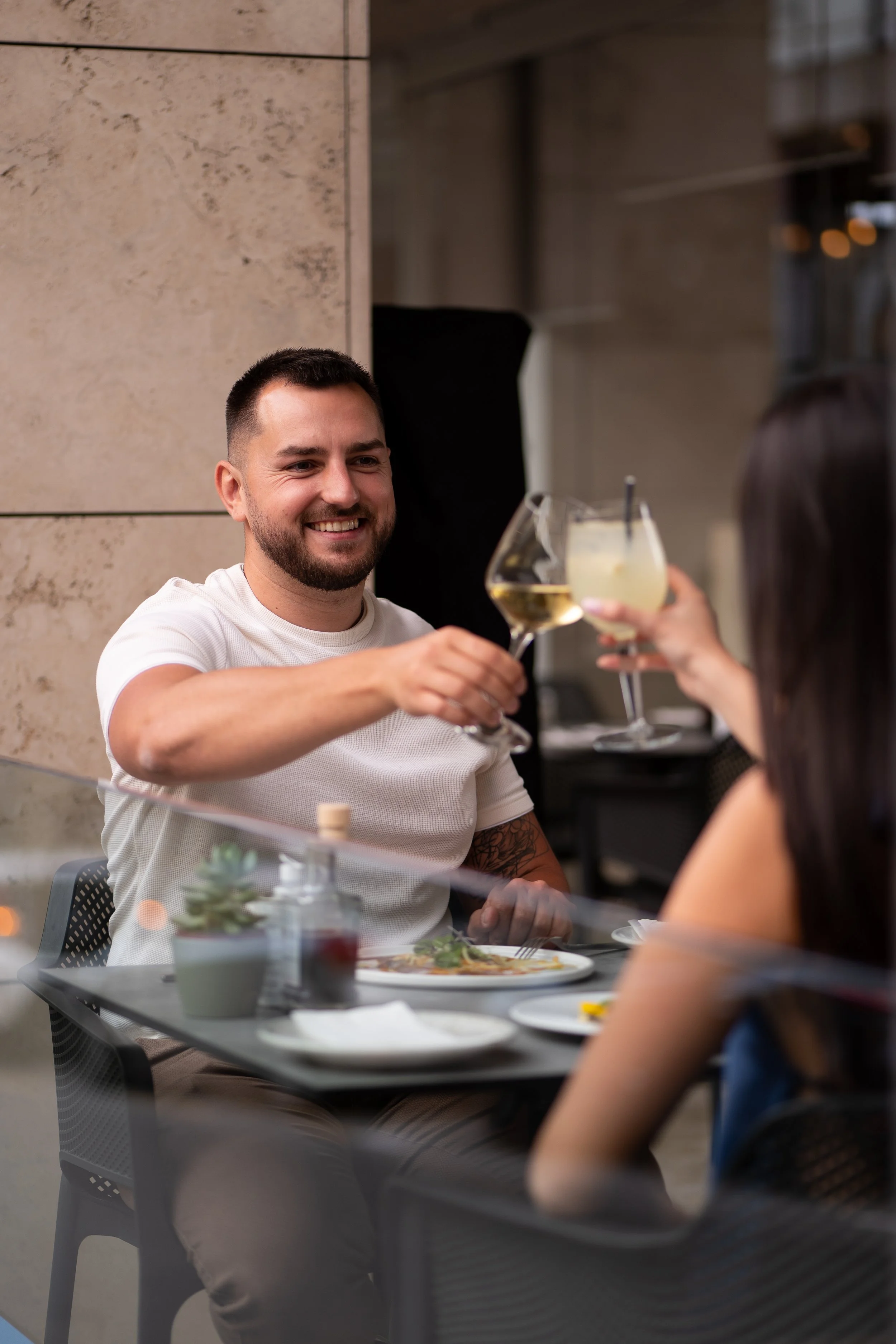 Hospitality lifestyle photography highlighting genuine moments between guests, creating engaging visual content for restaurant and hotel marketing.